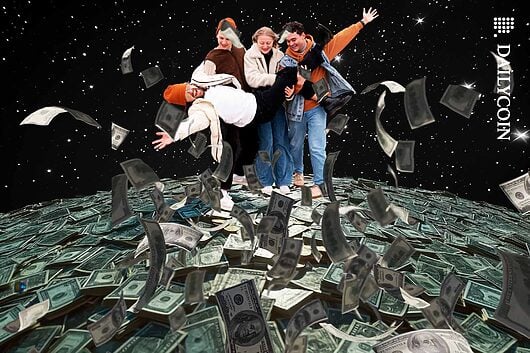 Group of friends celebrating on a pile of money.