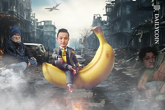 Justin Sun posing with a large banana in a very poor, war thorned area.